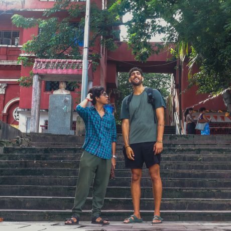 h2-FAQ-two-tour-participants-standing-on-the-stone-steps-of-chote-lal-ghat-along-the-hooghly-river-during-the-kolkata-early-morning-tour